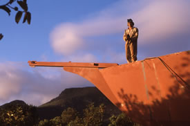 Nick standing on the bow of the boat before removal of the bowsprit